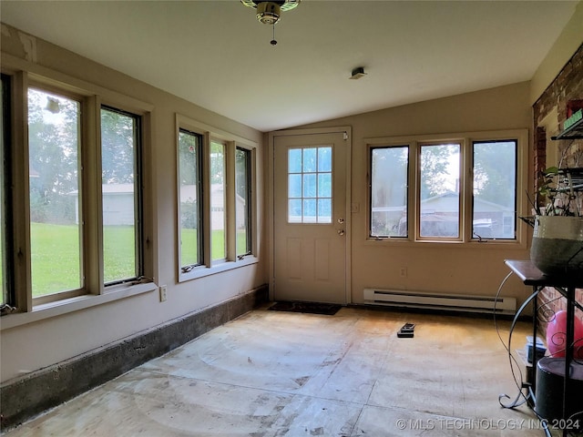 unfurnished sunroom featuring vaulted ceiling and a baseboard heating unit