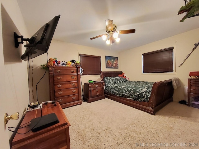 carpeted bedroom with ceiling fan