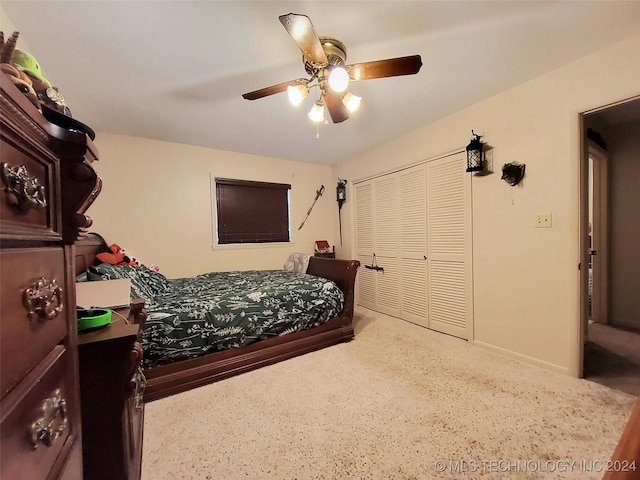 bedroom with carpet flooring, ceiling fan, and a closet