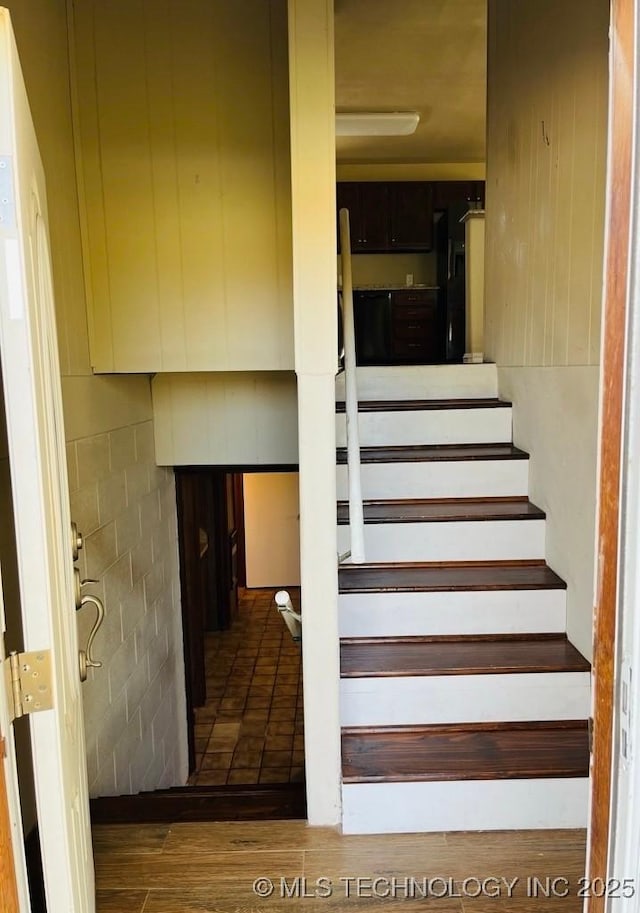 stairs with hardwood / wood-style flooring