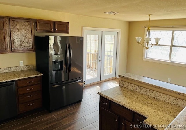 kitchen featuring french doors, pendant lighting, a notable chandelier, stainless steel fridge with ice dispenser, and black dishwasher