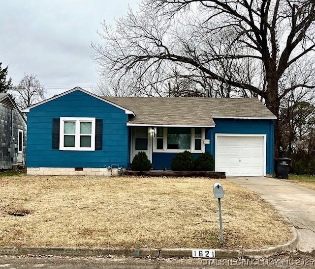 ranch-style house featuring a garage