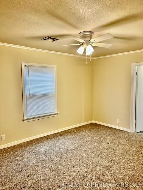 carpeted spare room featuring a textured ceiling, ceiling fan, and crown molding