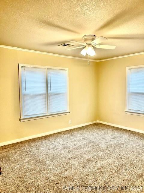 unfurnished room with carpet, ceiling fan, ornamental molding, and a textured ceiling