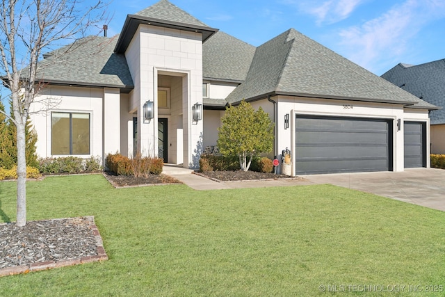 view of front of property with a garage and a front lawn