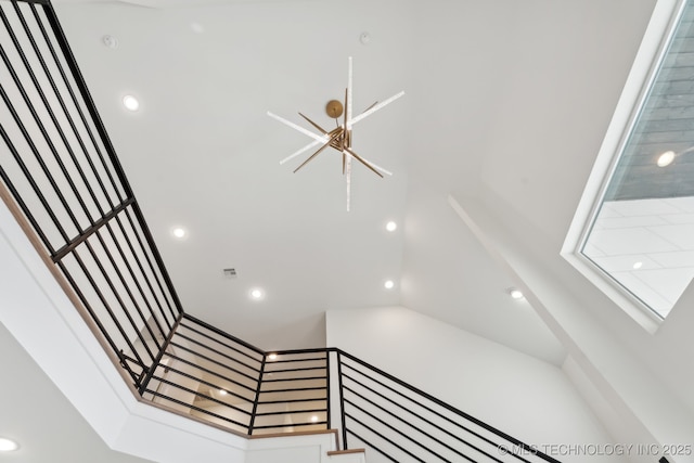 stairway with an inviting chandelier