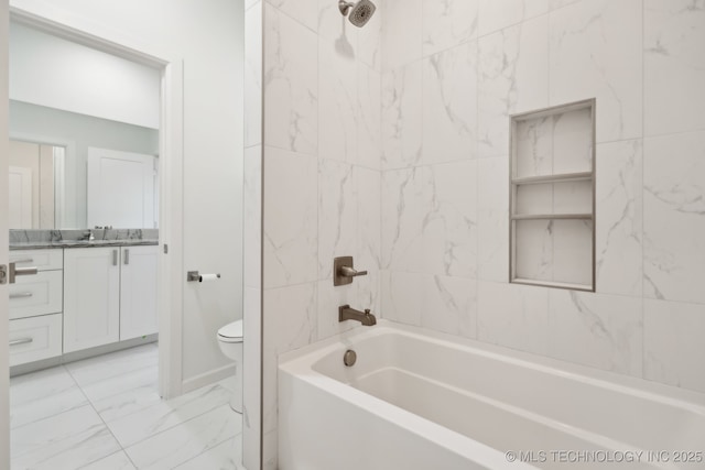 full bathroom featuring vanity, toilet, and tiled shower / bath combo