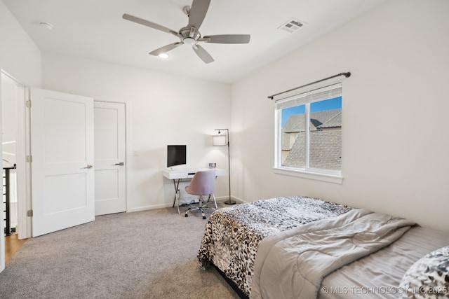 bedroom featuring light carpet and ceiling fan