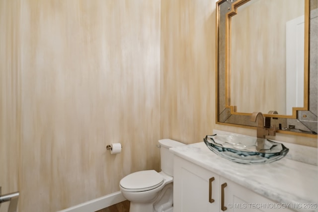 bathroom with vanity and toilet