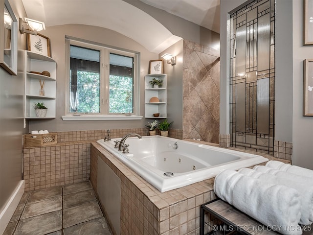bathroom featuring a tub with jets