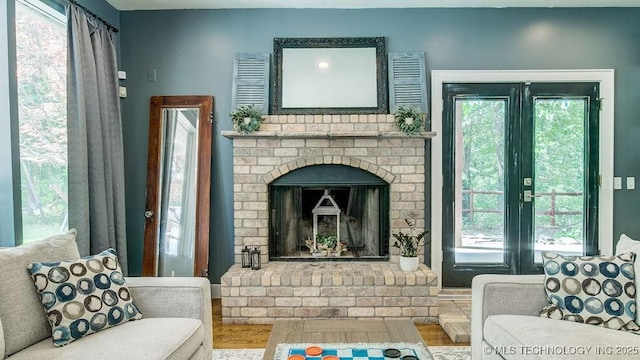 living area featuring a healthy amount of sunlight and a fireplace
