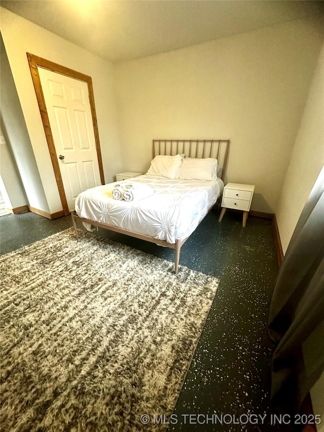 bedroom featuring baseboards