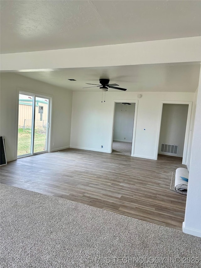 unfurnished room with hardwood / wood-style floors and ceiling fan