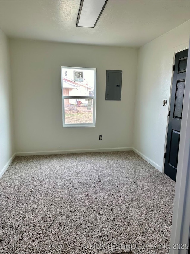 unfurnished room with carpet flooring and electric panel