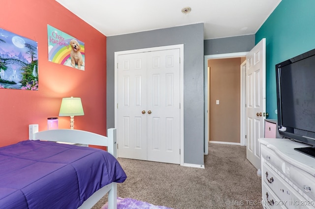 carpeted bedroom with a closet