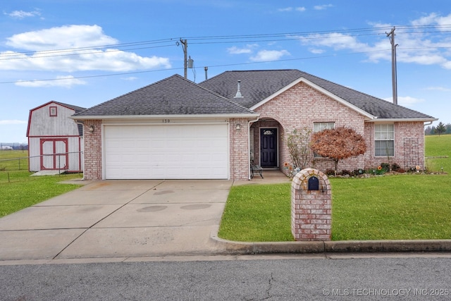 ranch-style home featuring a front lawn and a garage