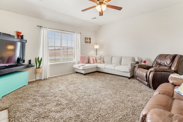 carpeted living room featuring ceiling fan and vaulted ceiling