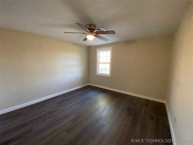 unfurnished room featuring ceiling fan and dark hardwood / wood-style flooring