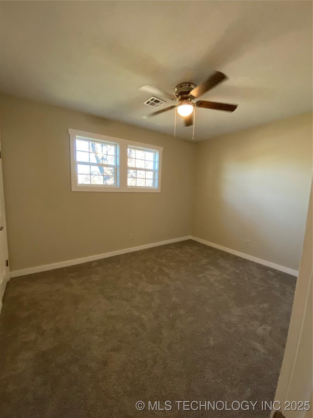 carpeted spare room with ceiling fan