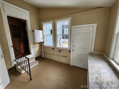 entryway featuring lofted ceiling