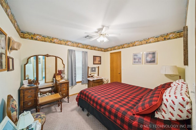 bedroom featuring visible vents, a ceiling fan, and carpet floors