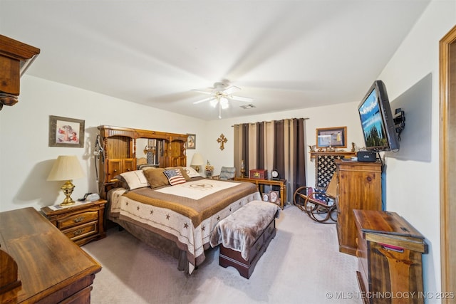 bedroom with visible vents, carpet, and a ceiling fan