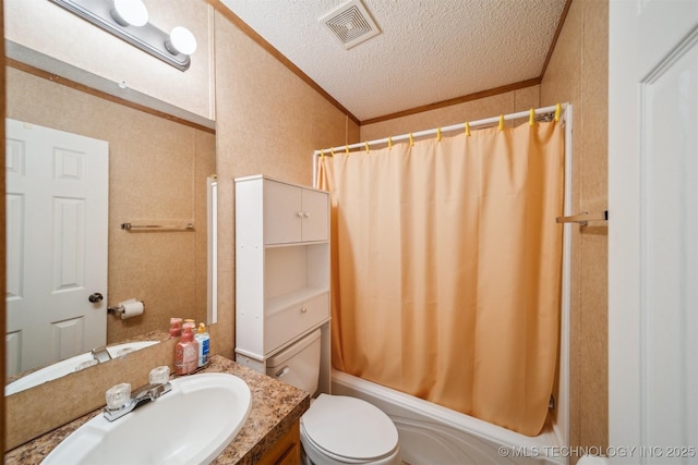 bathroom with visible vents, shower / tub combo with curtain, ornamental molding, a textured ceiling, and vanity