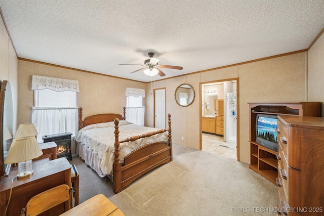 carpeted bedroom with connected bathroom, a textured ceiling, crown molding, and ceiling fan