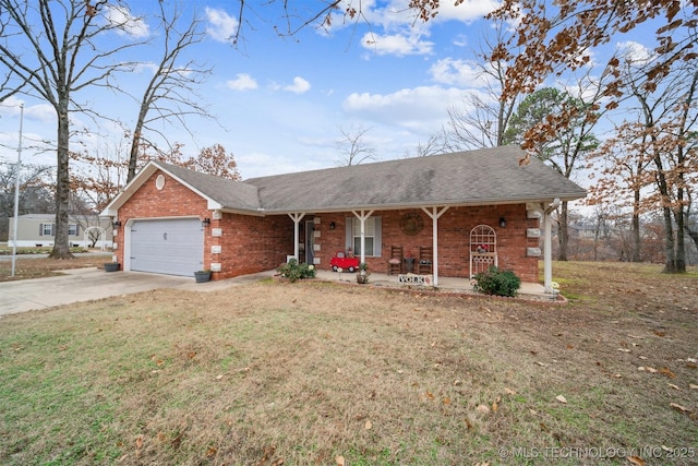 ranch-style home featuring driveway, an attached garage, covered porch, a front lawn, and brick siding