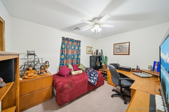 office with carpet flooring, a ceiling fan, and visible vents