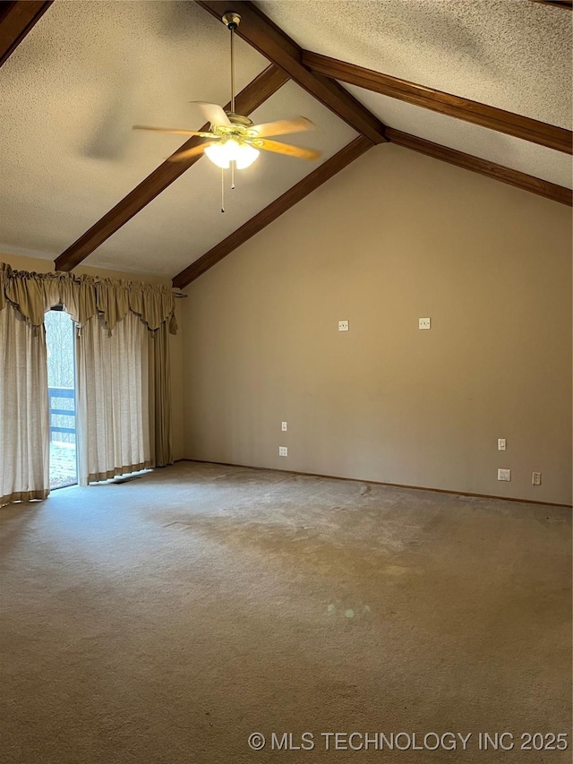 spare room with a textured ceiling, a ceiling fan, light colored carpet, and vaulted ceiling with beams