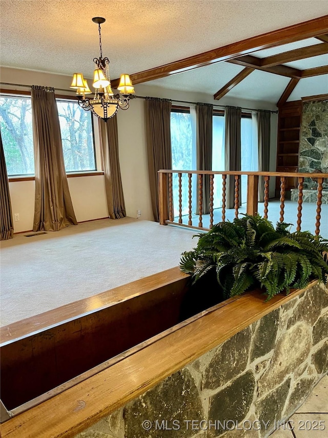 carpeted dining room with a wealth of natural light, a chandelier, vaulted ceiling with beams, and a textured ceiling