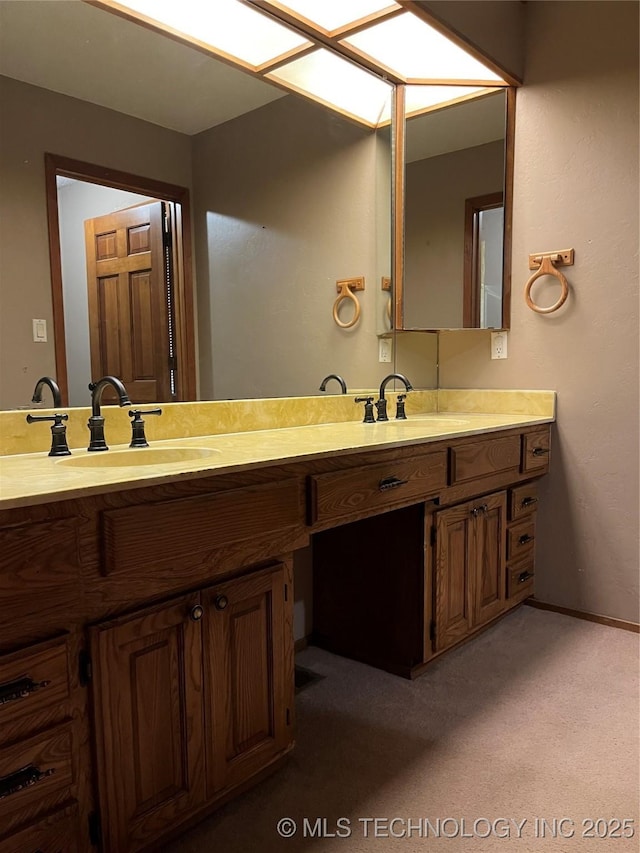 bathroom with baseboards and vanity