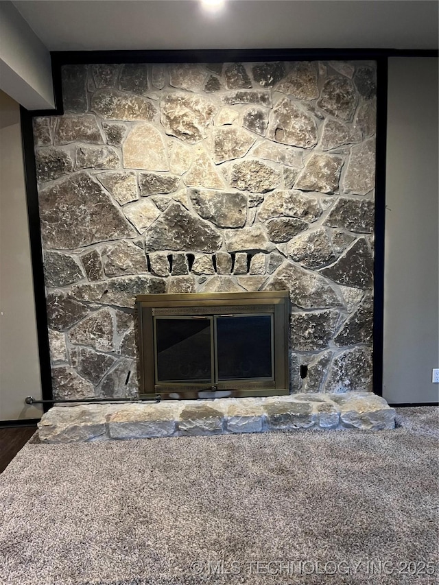 details with a glass covered fireplace