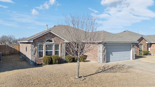 single story home featuring a garage