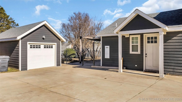 view of front of house with an outdoor structure and a garage