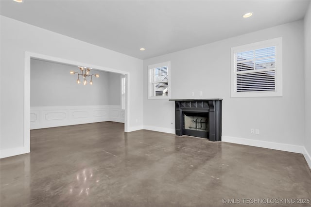 unfurnished living room featuring a chandelier