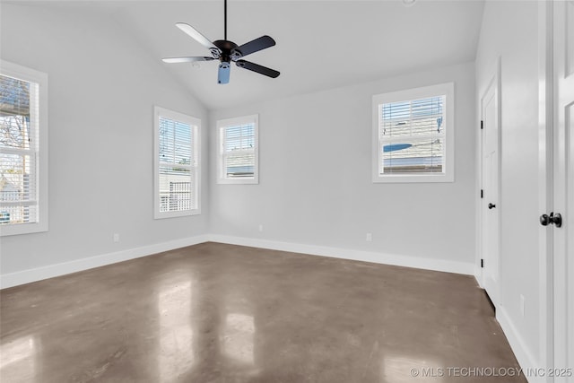 empty room featuring vaulted ceiling, a wealth of natural light, and ceiling fan