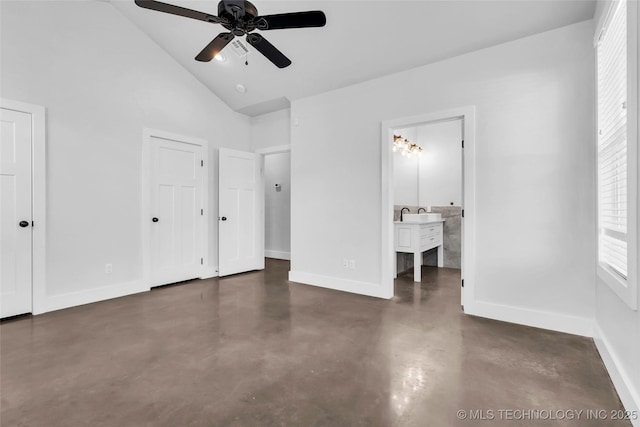 unfurnished bedroom with ensuite bathroom, high vaulted ceiling, ceiling fan, and multiple closets