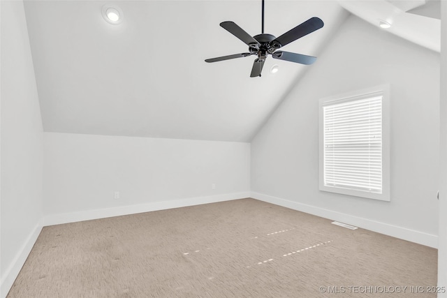 additional living space with carpet flooring, ceiling fan, and lofted ceiling