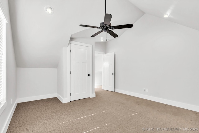 bonus room featuring ceiling fan, carpet floors, and vaulted ceiling