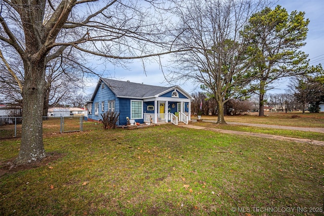 bungalow-style house with a front lawn