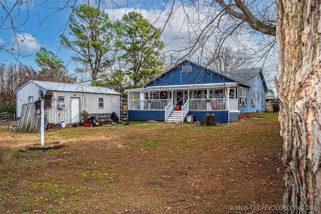 back of property with covered porch