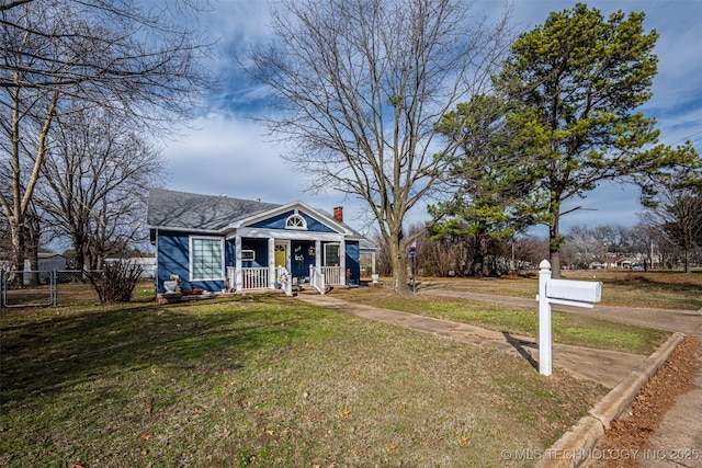 view of front of house featuring a front lawn and a porch