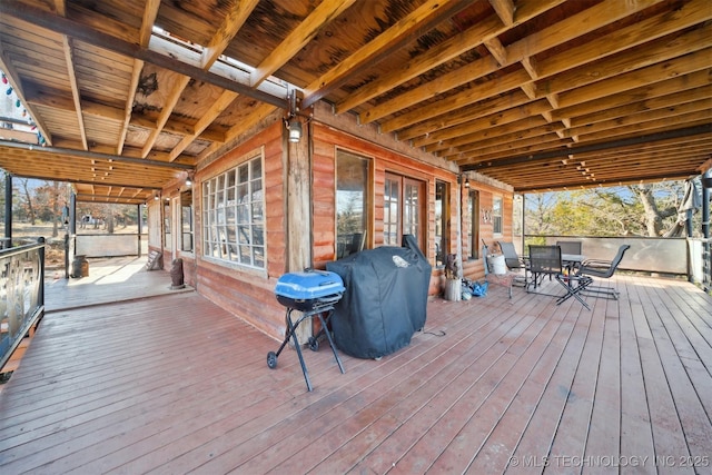 wooden deck with grilling area