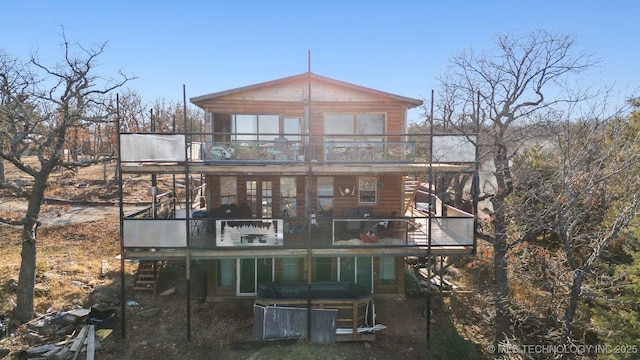 back of house with a balcony