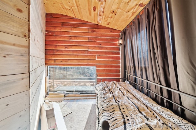 interior space with hardwood / wood-style flooring, wood walls, wooden ceiling, and vaulted ceiling