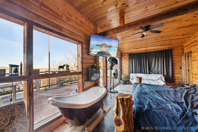 bedroom featuring wood-type flooring, lofted ceiling with beams, multiple windows, and wooden ceiling