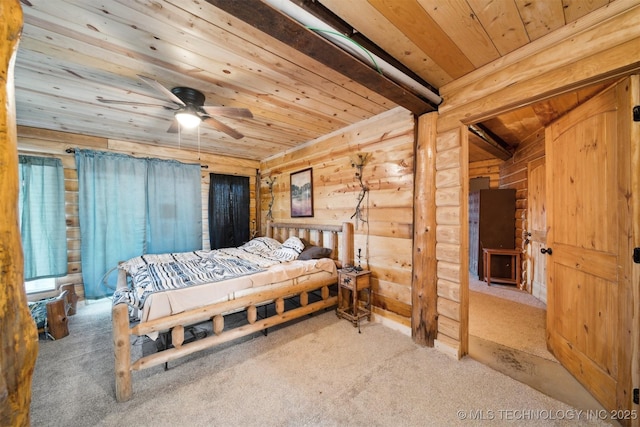 bedroom with carpet flooring, beam ceiling, ceiling fan, and wood ceiling