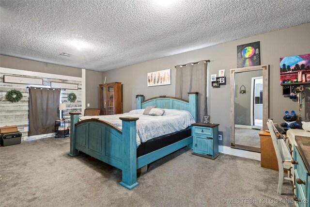 carpeted bedroom featuring a textured ceiling